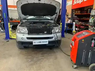 Various Land Rover and Range Rover models in different settings serviced by AJ 4X4 