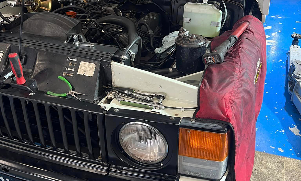 Land Rover clutch components undergoing repair and maintenance at AJ 4X4 